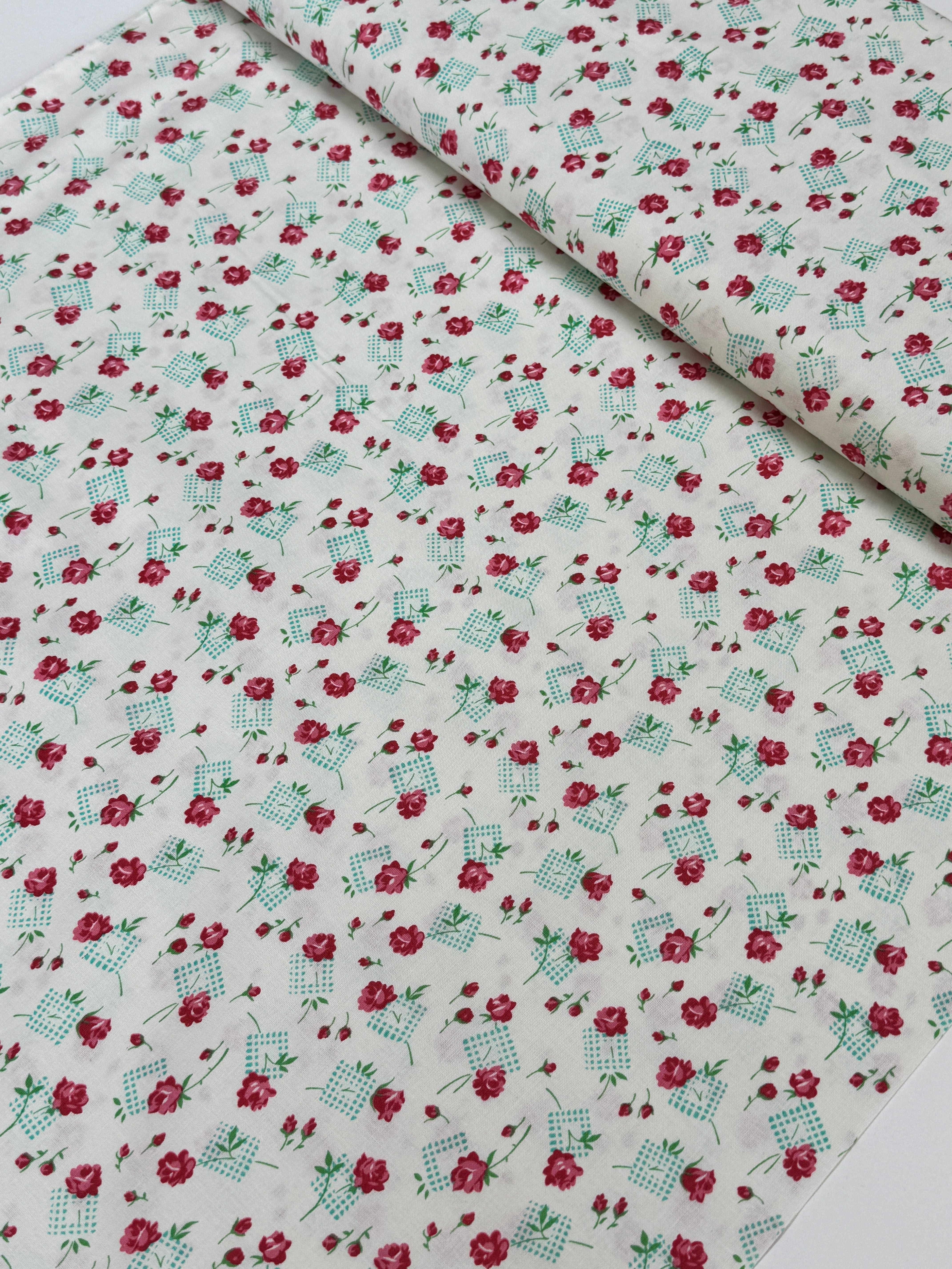 Pink roses and rosebuds with mint gingham accents scattered across a coconut cream background, Sugar Bloom Gingham Garden Coconut cotton fabric.