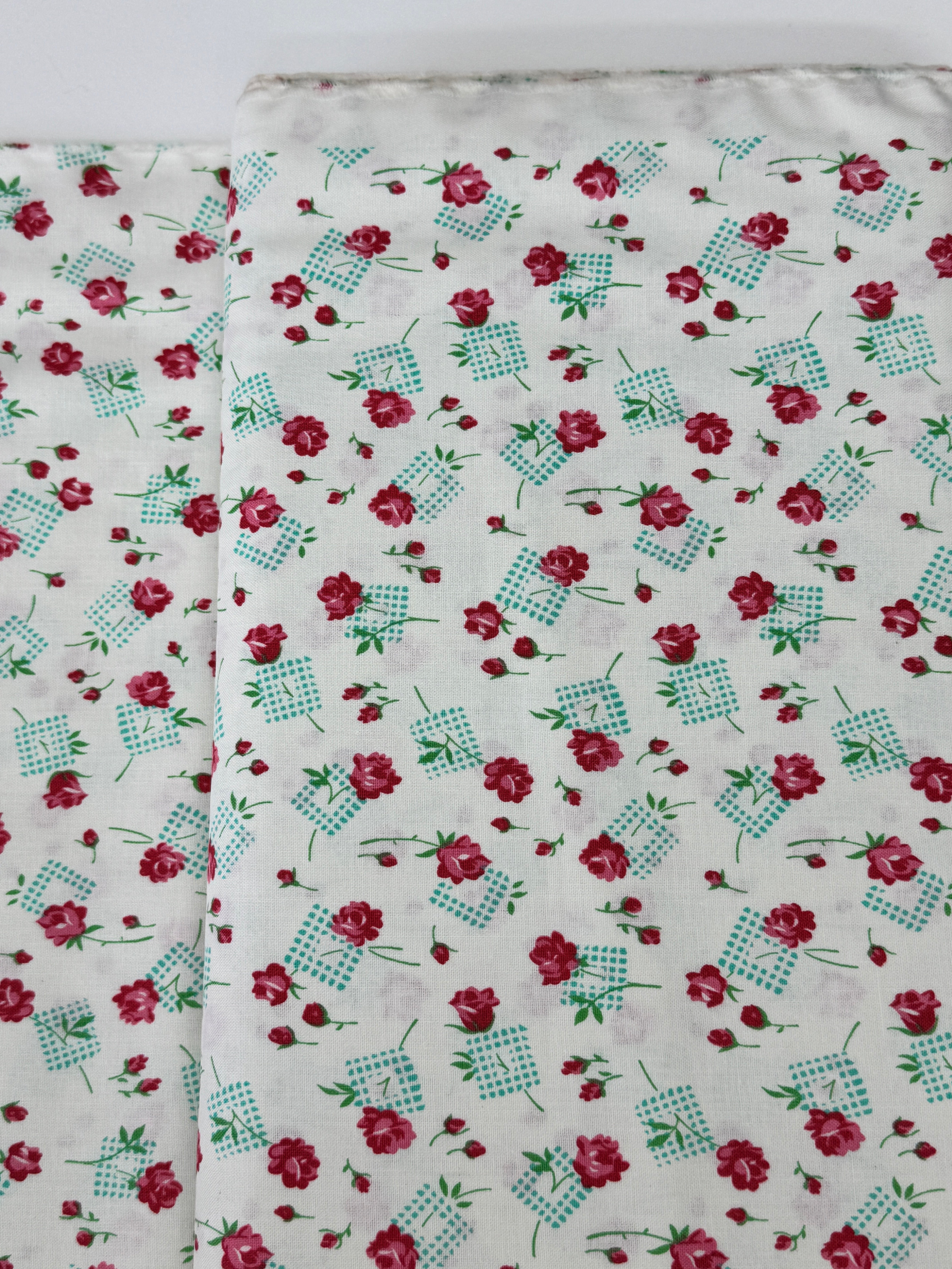 Pink roses and rosebuds with mint gingham accents scattered across a coconut cream background, Sugar Bloom Gingham Garden Coconut cotton fabric.
