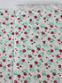Pink roses and rosebuds with mint gingham accents scattered across a coconut cream background, Sugar Bloom Gingham Garden Coconut cotton fabric.