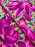 Large pink, magenta, and coral lotus flowers on an ochre leopard-print background, Leopard Lotus Ochre fabric by Philip Jacobs for FreeSpirit Fabrics.