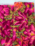 Large pink, magenta, and coral lotus flowers on an ochre leopard-print background, Leopard Lotus Ochre fabric by Philip Jacobs for FreeSpirit Fabrics.