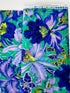Large blue and lavender orchids with tropical blooms on a vibrant turquoise background, Orchids Blue fabric by Philip Jacobs for FreeSpirit Fabrics.