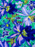 Large blue and lavender orchids with tropical blooms on a vibrant turquoise background, Orchids Blue fabric by Philip Jacobs for FreeSpirit Fabrics.