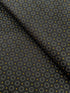Gray stitched circles and tiny golden dots scattered across a black background, Rings of Dots Black fabric from the Harvest Moon collection by Andover Fabrics.
