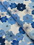 Blue and white flowers with pearlescent shimmer accents scattered across a white background, Packed Shimmer Flower White Pearlescent fabric by Greta Lynn for Kanvas Studio Benartex.