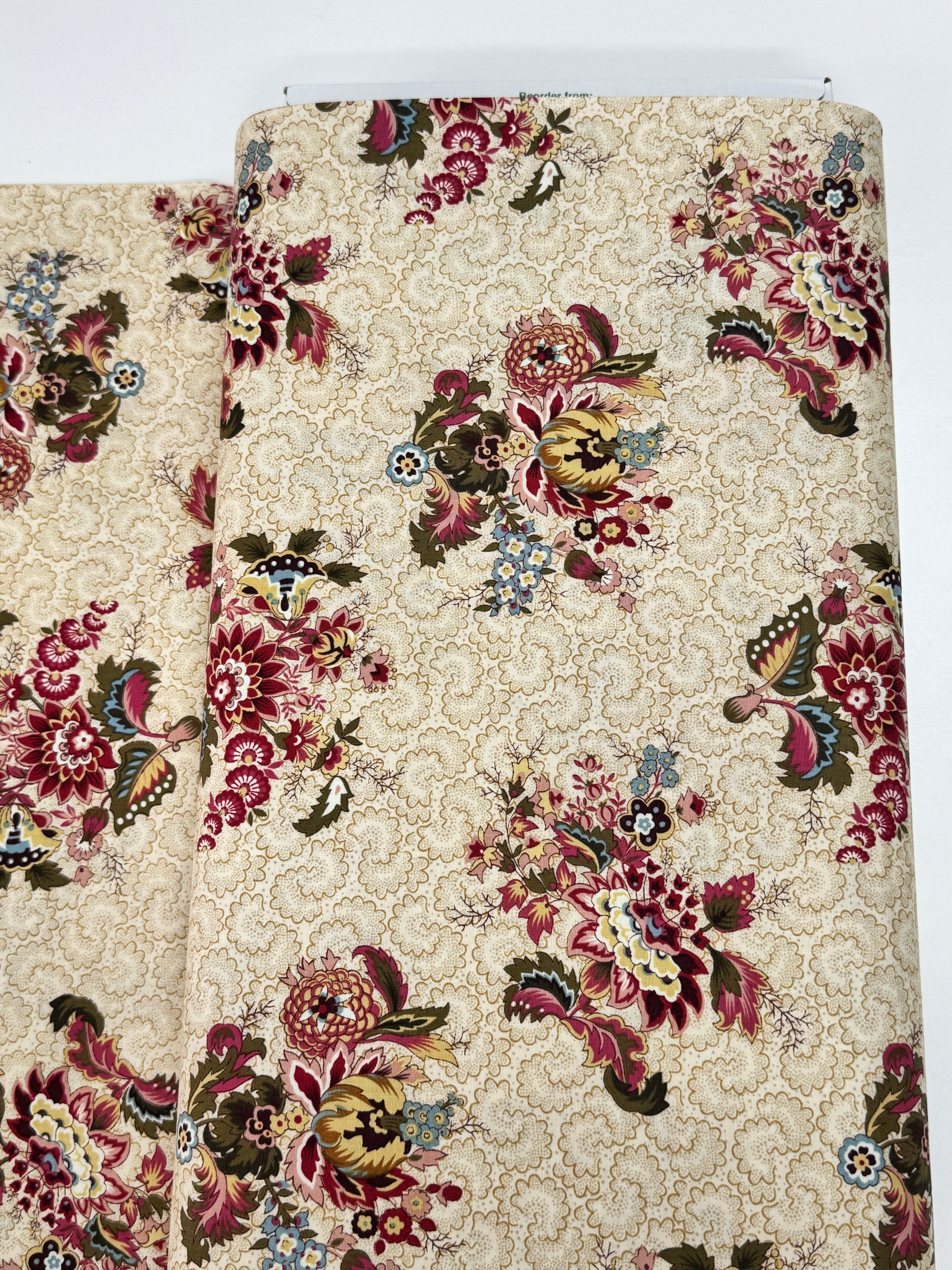 Vintage floral cotton fabric featuring colorful bouquet medallions on a cream foulard background, Marseille collection by Dover Hill for Benartex.