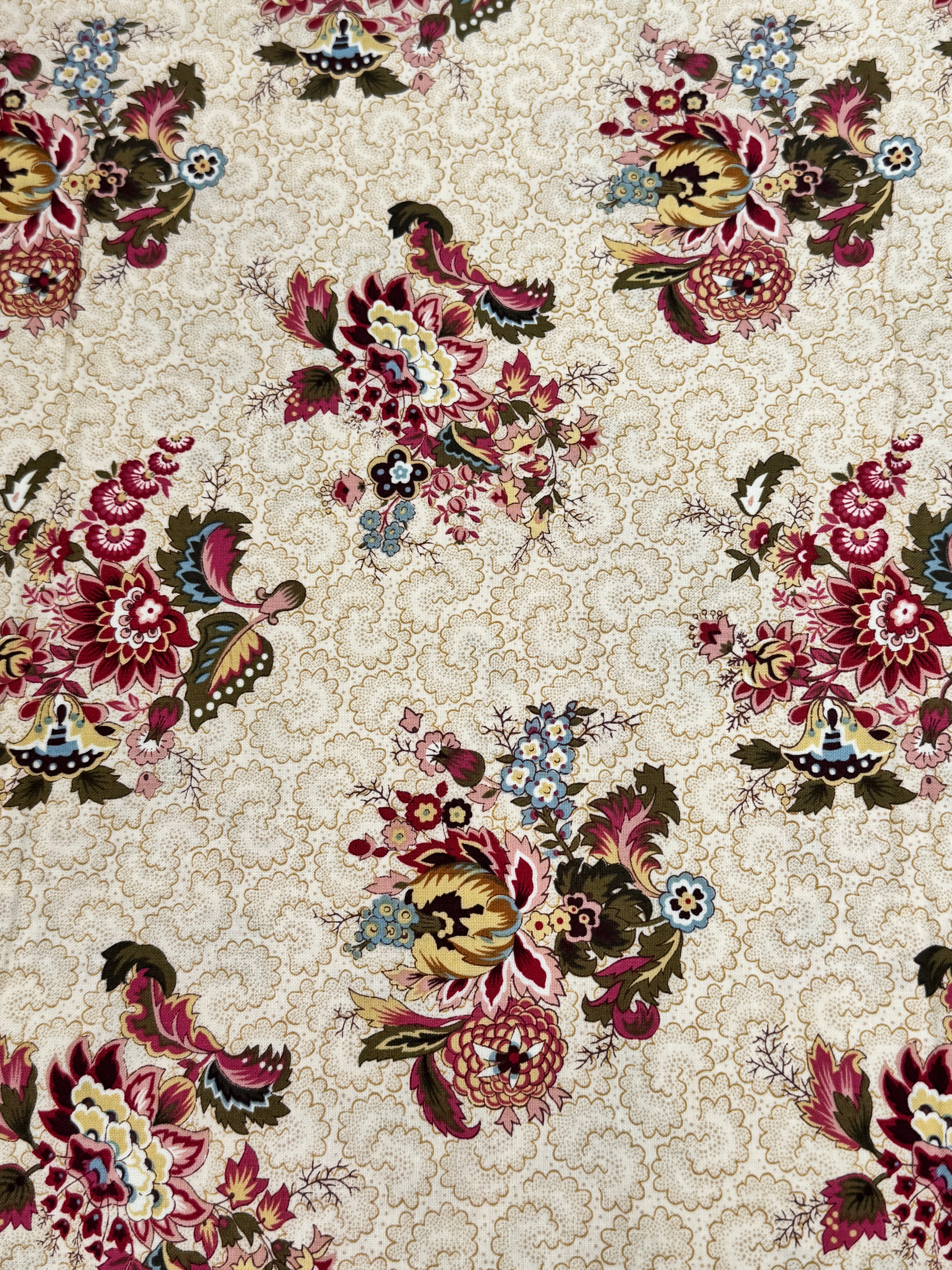 Vintage floral cotton fabric featuring colorful bouquet medallions on a cream foulard background, Marseille collection by Dover Hill for Benartex.