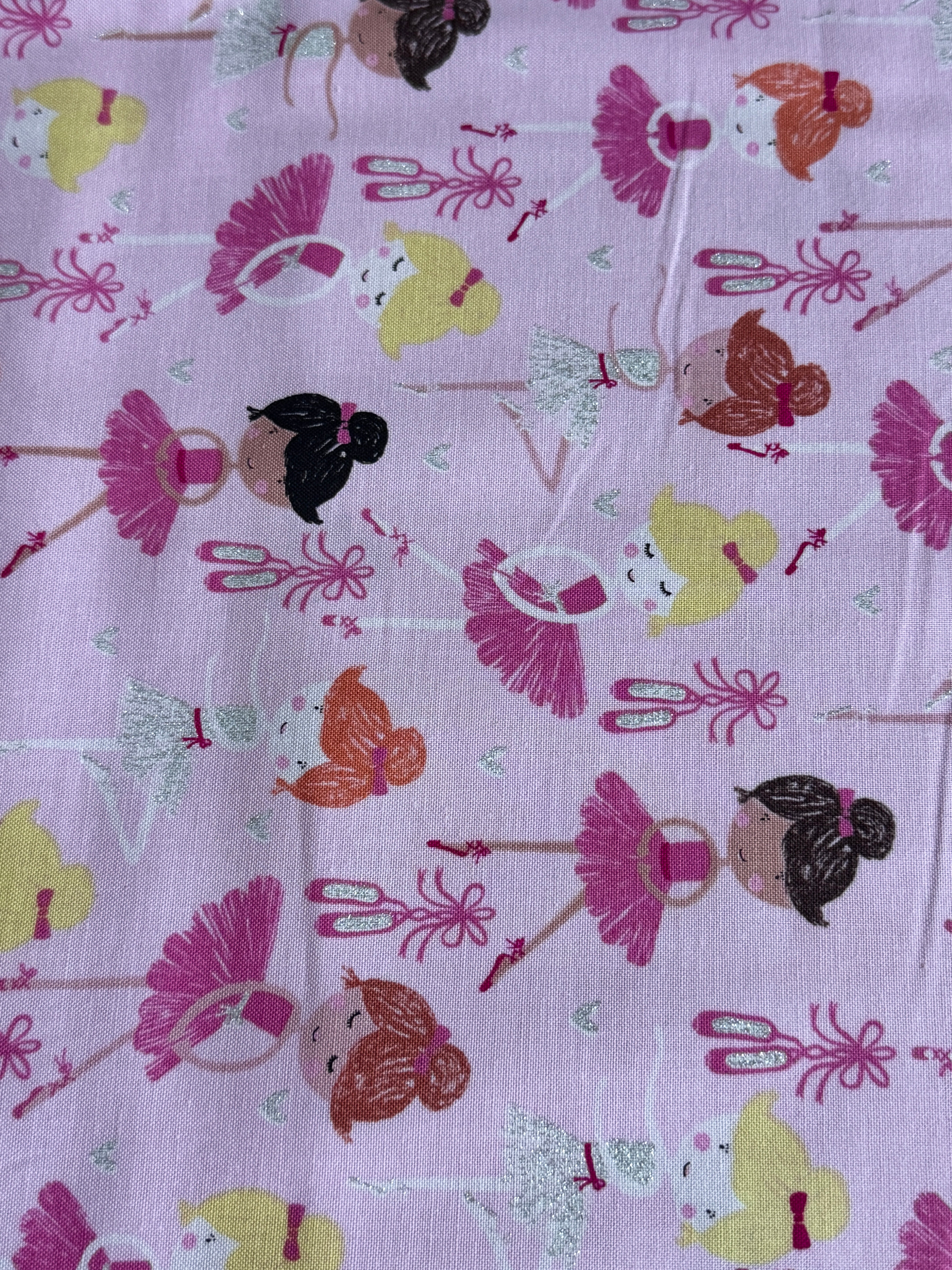 Pink cotton fabric featuring tossed ballerinas, tutus, ballet shoes, and silver glitter accents by Timeless Treasures.