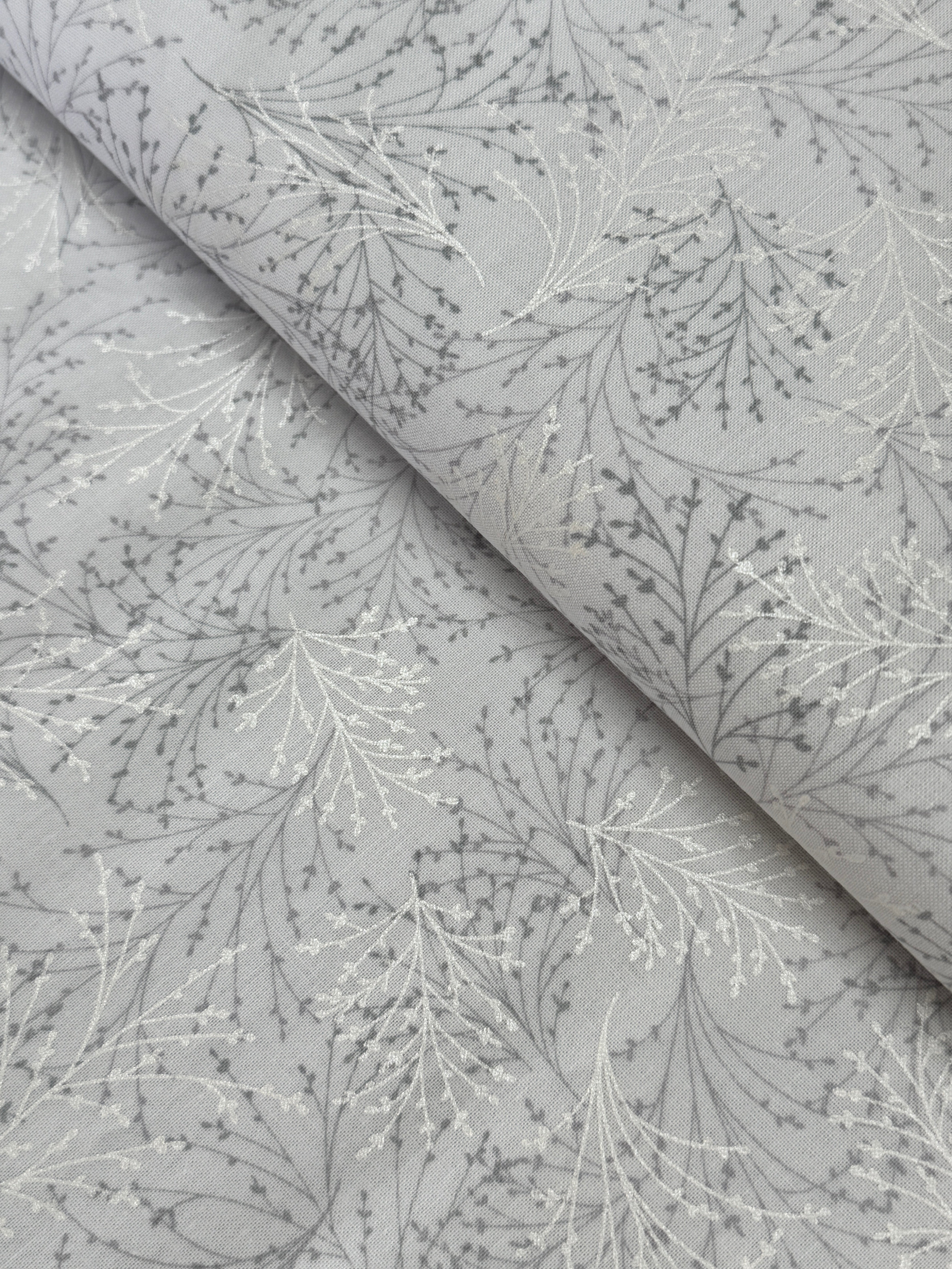 Pearl gray cotton fabric featuring delicate silver metallic botanical sprigs and branches by Kanvas Studio for Benartex.