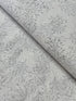 Pearl gray cotton fabric featuring delicate silver metallic botanical sprigs and branches by Kanvas Studio for Benartex.