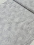 Pearl gray cotton fabric featuring delicate silver metallic botanical sprigs and branches by Kanvas Studio for Benartex.