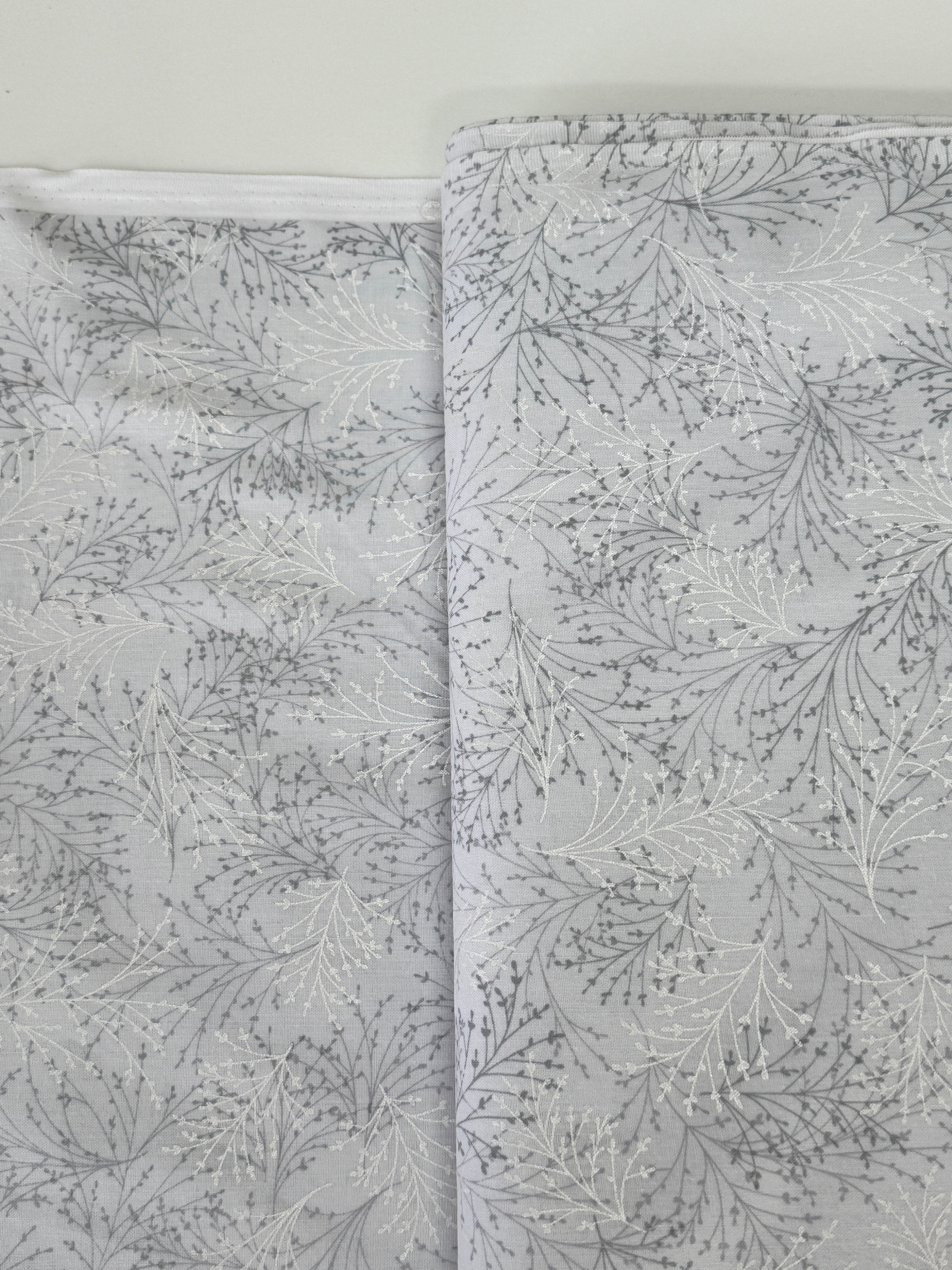 Pearl gray cotton fabric featuring delicate silver metallic botanical sprigs and branches by Kanvas Studio for Benartex.