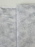 Pearl gray cotton fabric featuring delicate silver metallic botanical sprigs and branches by Kanvas Studio for Benartex.
