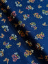 Navy cotton fabric featuring delicate floral blossoms and butterflies scattered throughout, from the Japanese Garden collection by Maywood Studio.