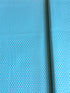 Aqua blue cotton fabric featuring small white polka dots in an all-over pattern by Robert Kaufman Fabrics, ideal for quilting, sewing, nursery décor, and craft projects.