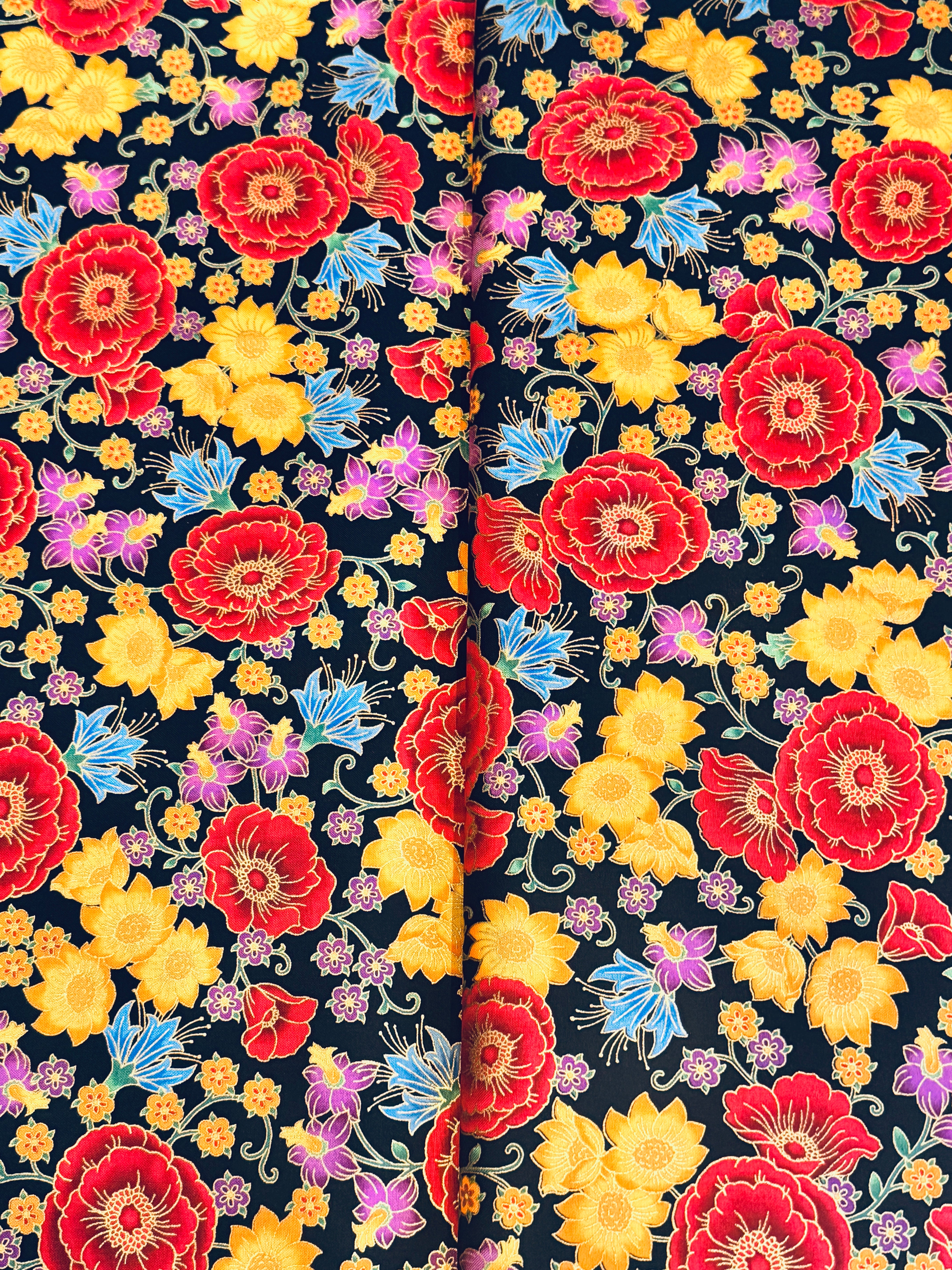 Florentine Garden Floral Multi Metallic cotton fabric by Hyun Joo Lee for Robert Kaufman featuring vibrant red, gold, purple, and blue flowers with metallic accents on a black background.