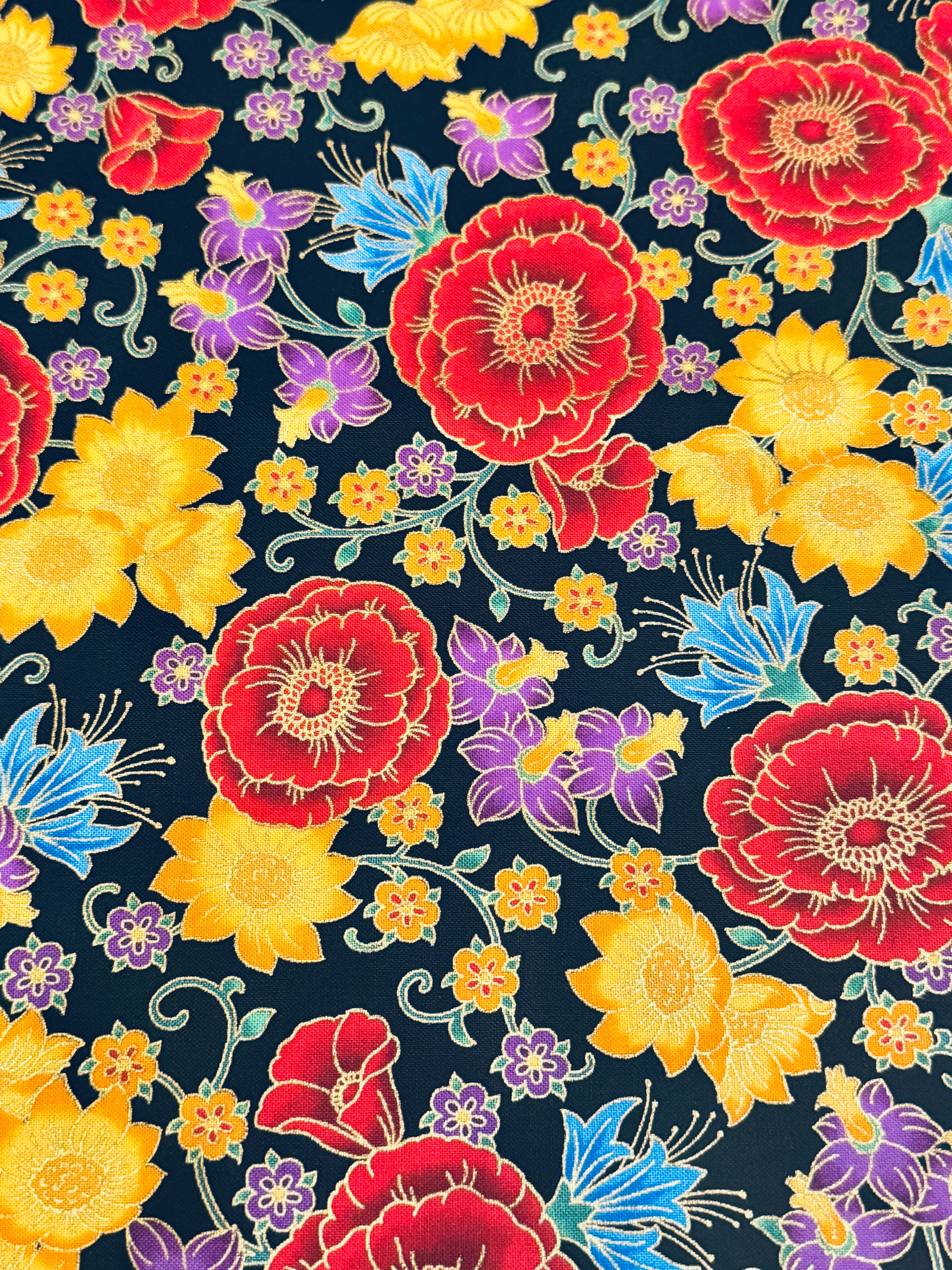 Florentine Garden Floral Multi Metallic cotton fabric by Hyun Joo Lee for Robert Kaufman featuring vibrant red, gold, purple, and blue flowers with metallic accents on a black background.