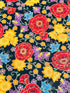 Florentine Garden Floral Multi Metallic cotton fabric by Hyun Joo Lee for Robert Kaufman featuring vibrant red, gold, purple, and blue flowers with metallic accents on a black background.