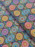 Pink mandala quilting fabric featuring colorful geometric floral medallions in turquoise, aqua, yellow, and lime green by Blank Quilting.