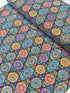 Pink mandala quilting fabric featuring colorful geometric floral medallions in turquoise, aqua, yellow, and lime green by Blank Quilting.