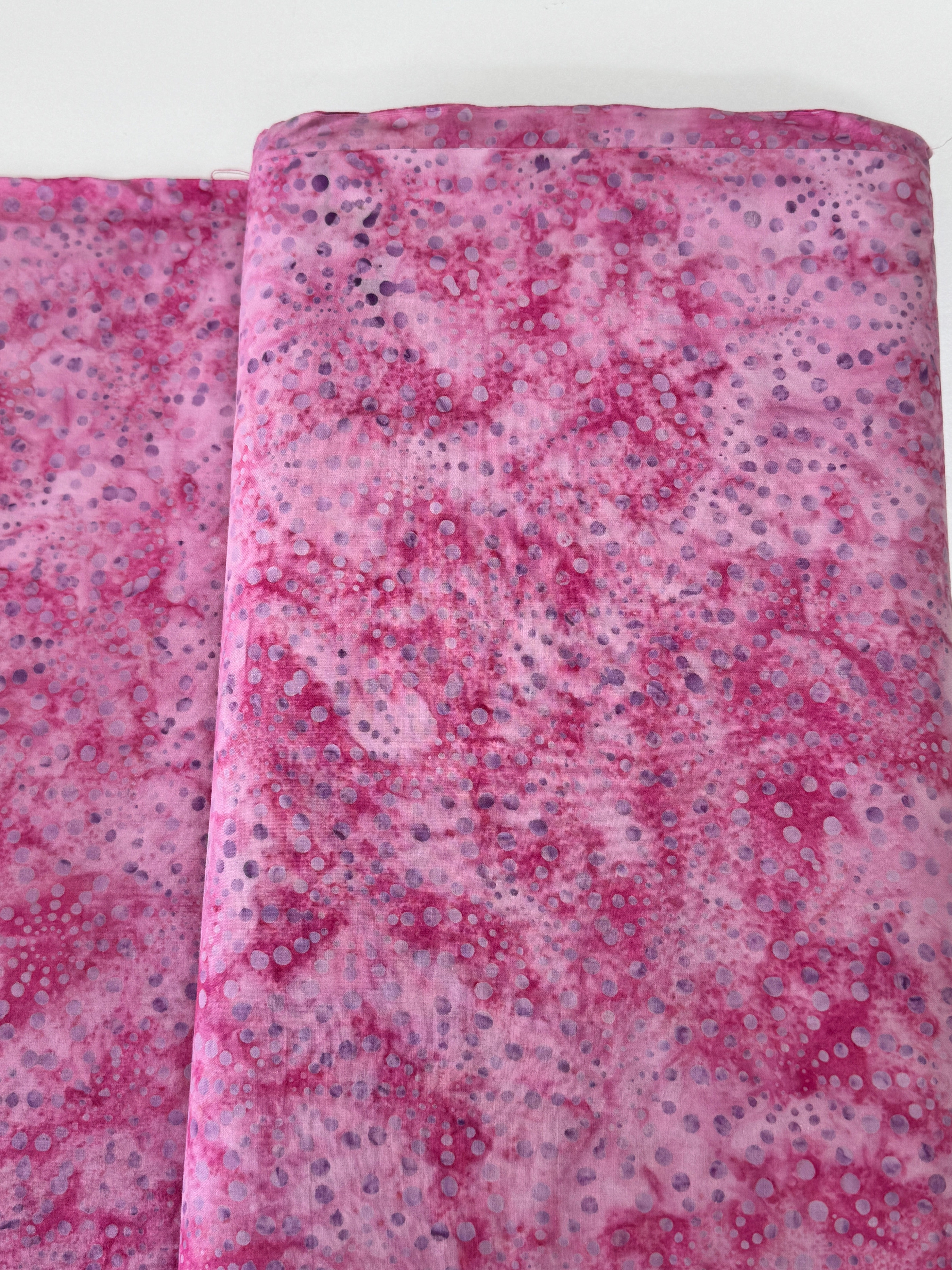 Bursts Rose Batik Fabric by Jinny Beyer – hand-dyed pink cotton batik with subtle bursts from Malam Batiks VIII by RJR Fabrics.