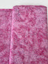 Bursts Rose Batik Fabric by Jinny Beyer – hand-dyed pink cotton batik with subtle bursts from Malam Batiks VIII by RJR Fabrics.