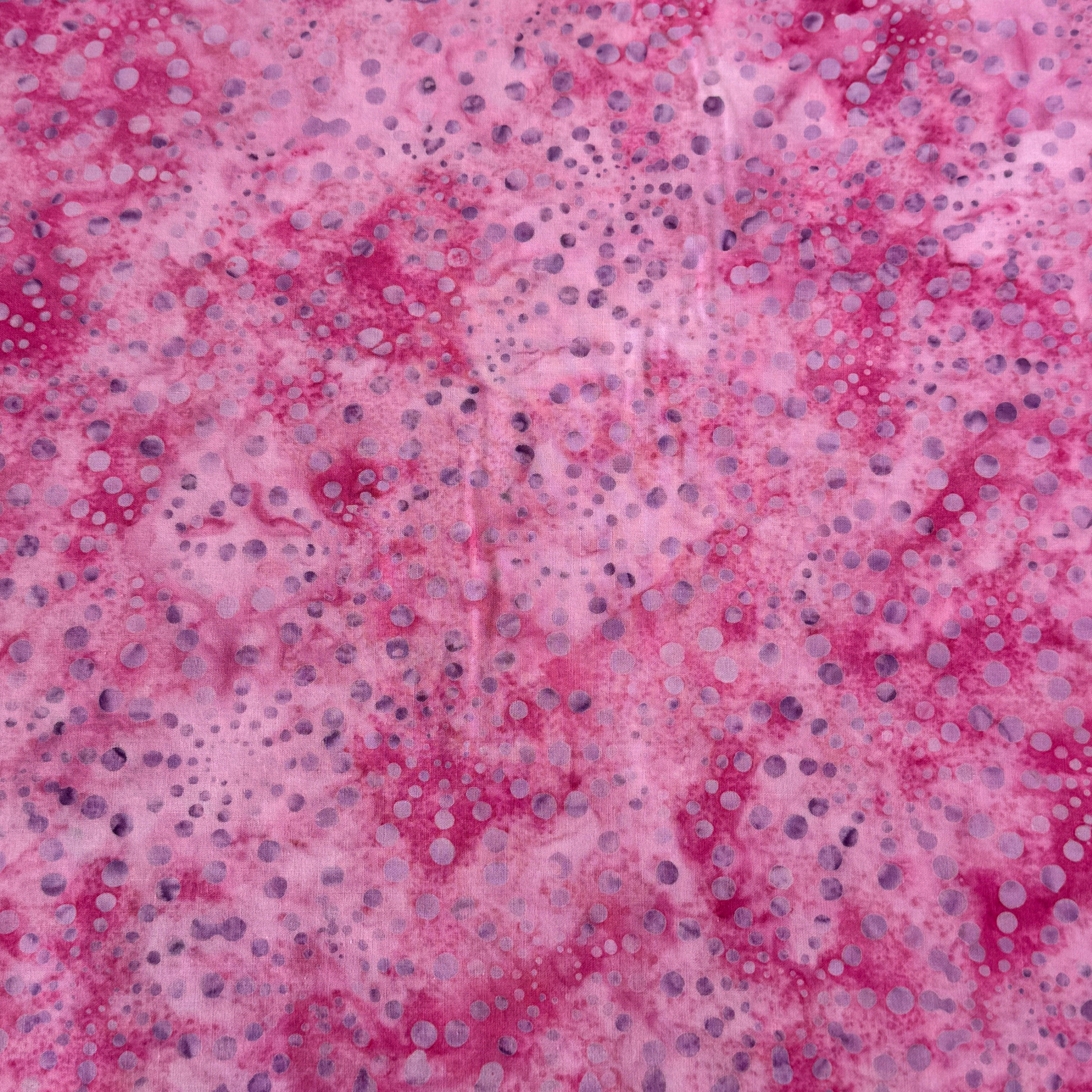 Bursts Rose Batik Fabric by Jinny Beyer – hand-dyed pink cotton batik with subtle bursts from Malam Batiks VIII by RJR Fabrics.