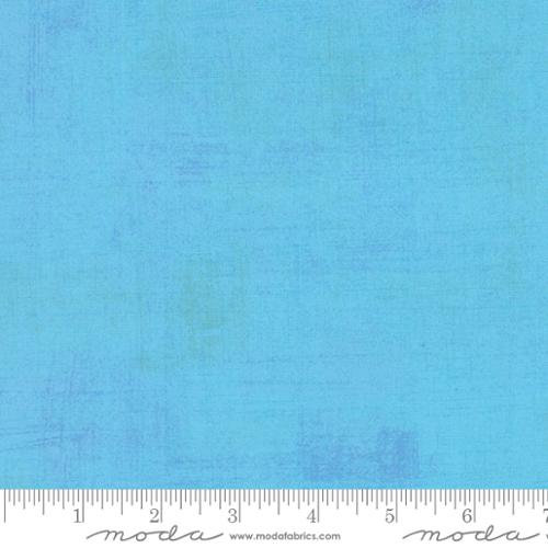 Grunge Basics Sky premium quilting cotton featuring a vibrant sky blue textured grunge design by BasicGrey for Moda Fabrics.