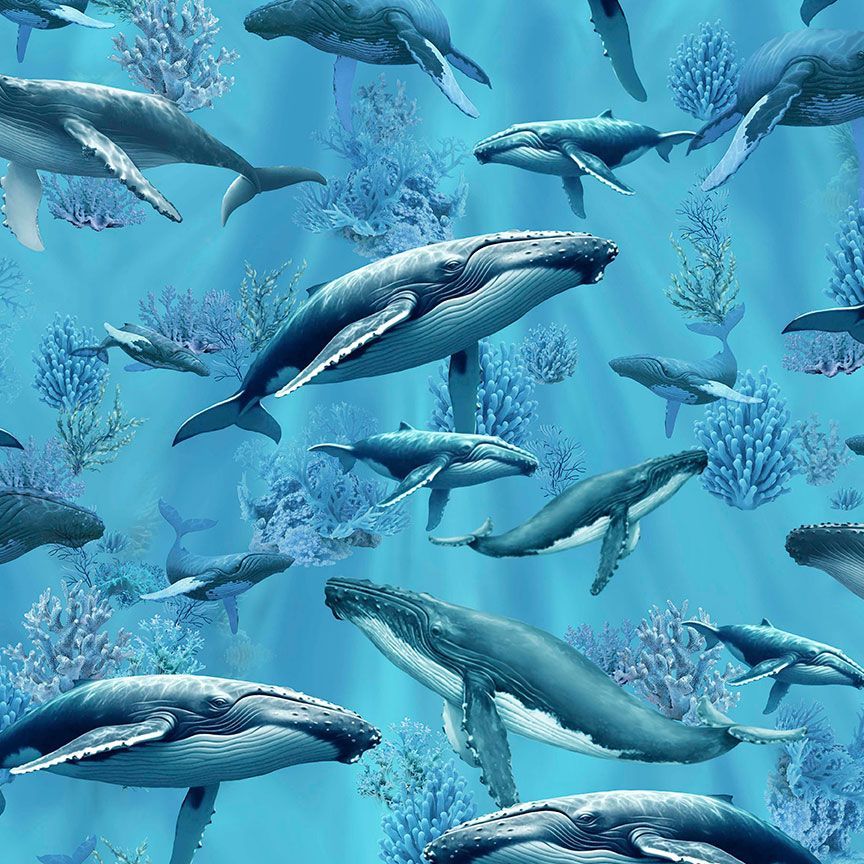 Humpback Whale cotton fabric by Timeless Treasures featuring whales swimming through blue ocean water with coral and underwater plants.