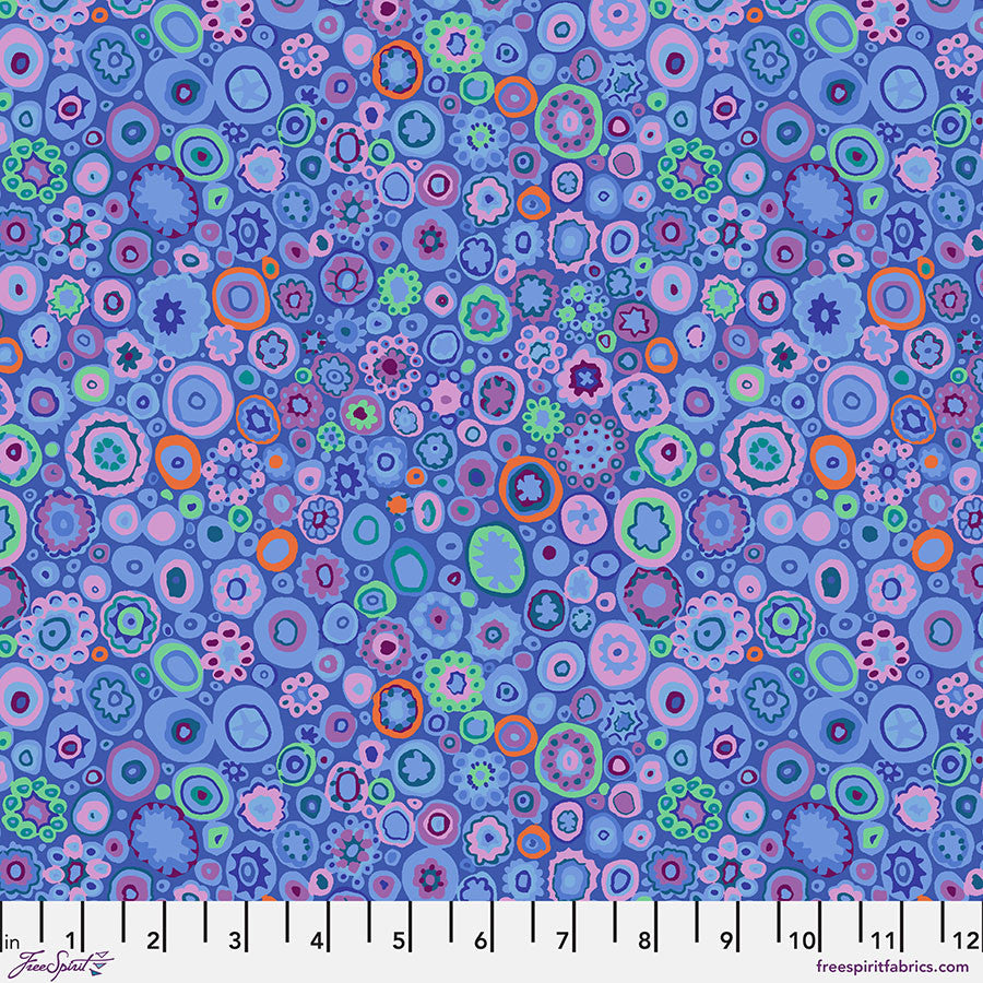 Kaffe Fassett Paperweight Blue fabric by Philip Jacobs featuring layered circular motifs in blue tones.