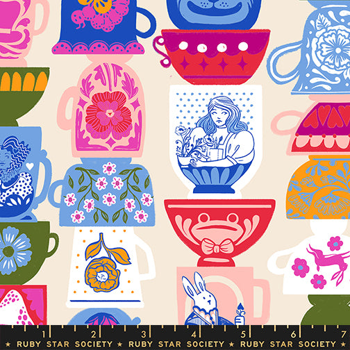Hello Alice Teacup Shell cotton fabric featuring stacked colorful teacups with floral and Alice motifs.