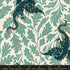 Fireglow Dragon Lair Watercress Metallic quilting cotton featuring deep teal dragons with metallic gold botanical vines on a soft cream background by Sarah Watts for Ruby Star Society and Moda Fabrics.