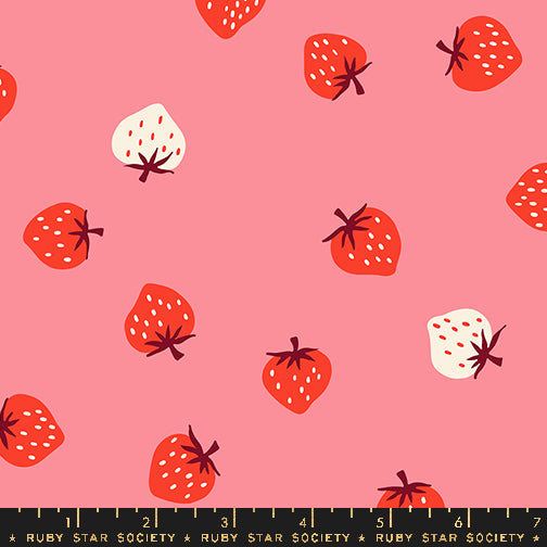 Strawberry Sorbet fabric by Kimberly Kight for Ruby Star Society and Moda Fabrics featuring scattered red and cream strawberries on a soft pink premium cotton background.