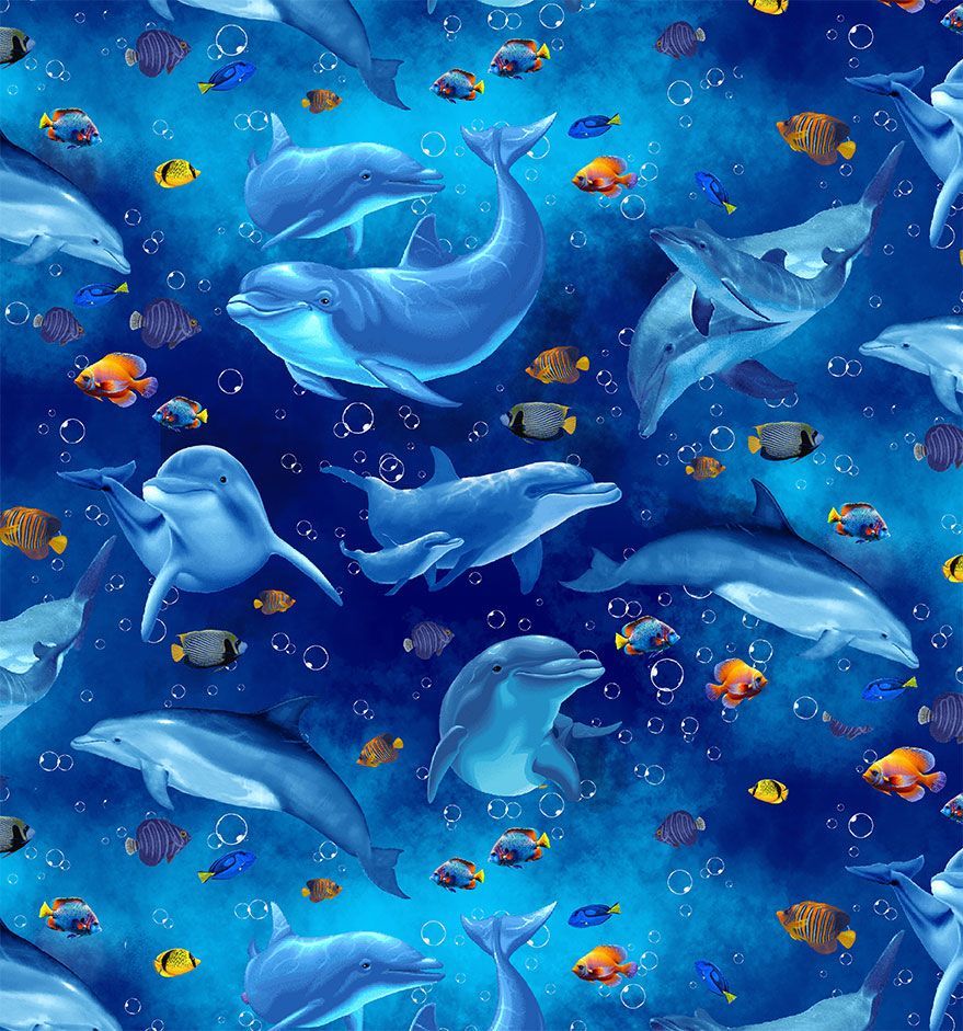 Playful dolphins and fish swimming on Ocean Life fabric by Timeless Treasures