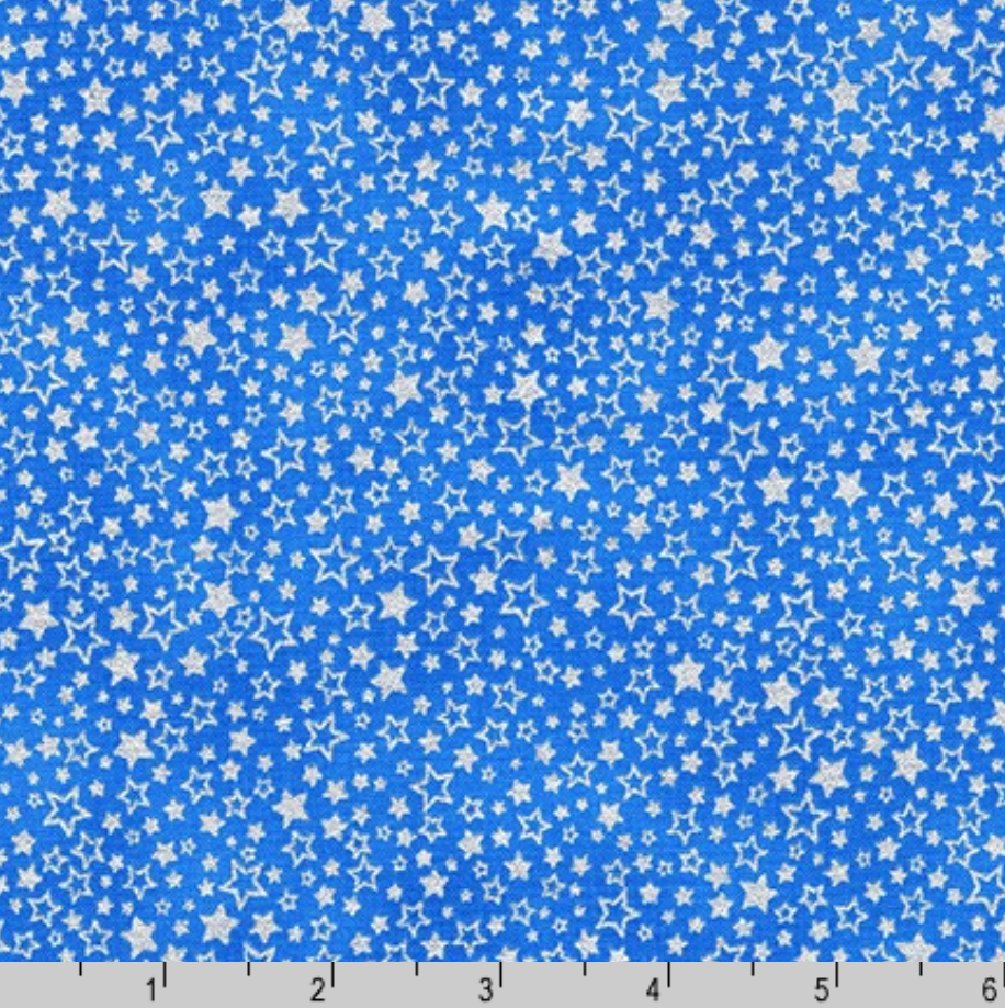 Holiday Charms fabric with silver stars on blue by Studio RK for Robert Kaufman.