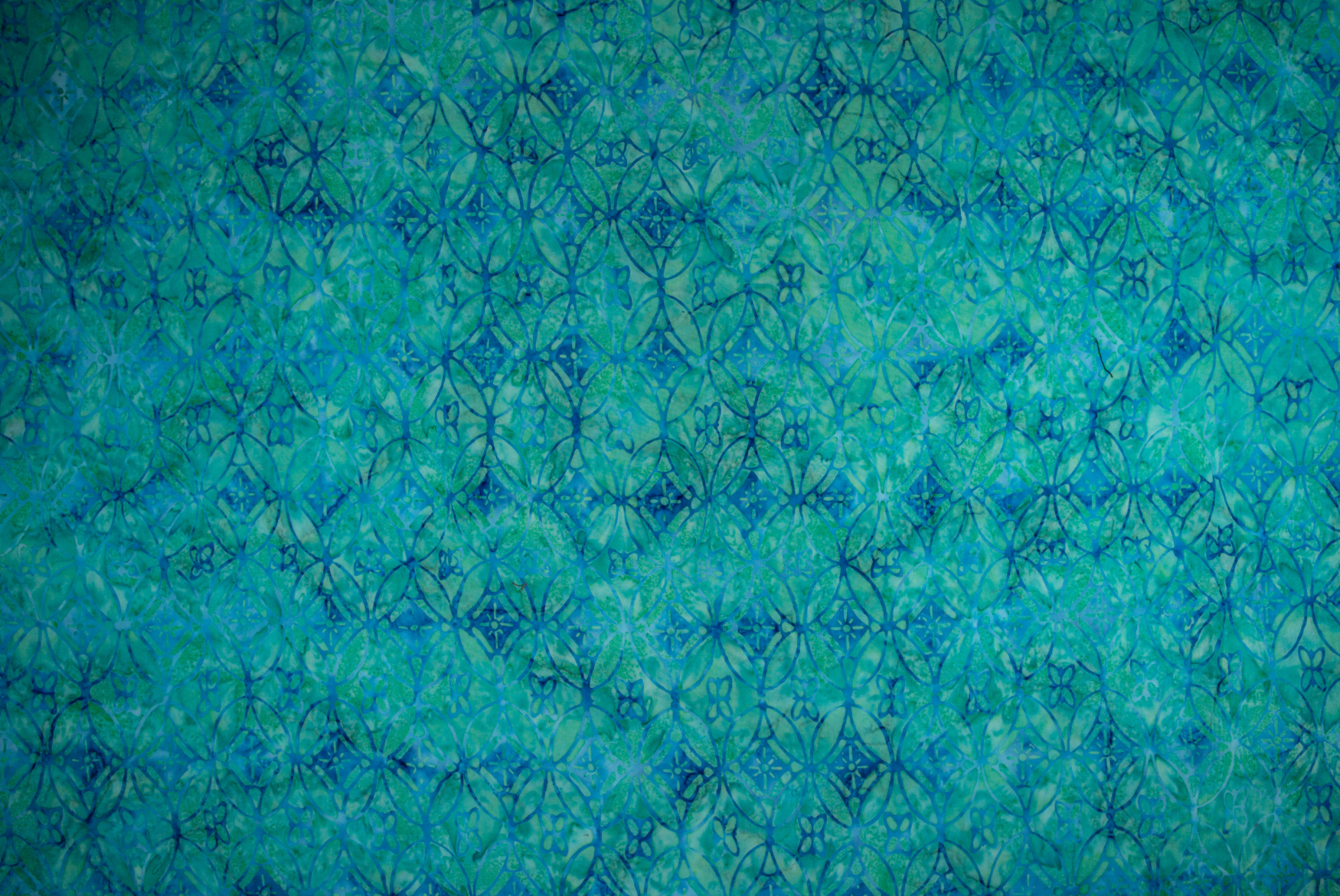 Malam Batiks X – Legacy – Ovals – Aquamarine batik fabric by Jinny Beyer for RJR Fabrics, featuring intricate oval patterns in soothing aquamarine hues.