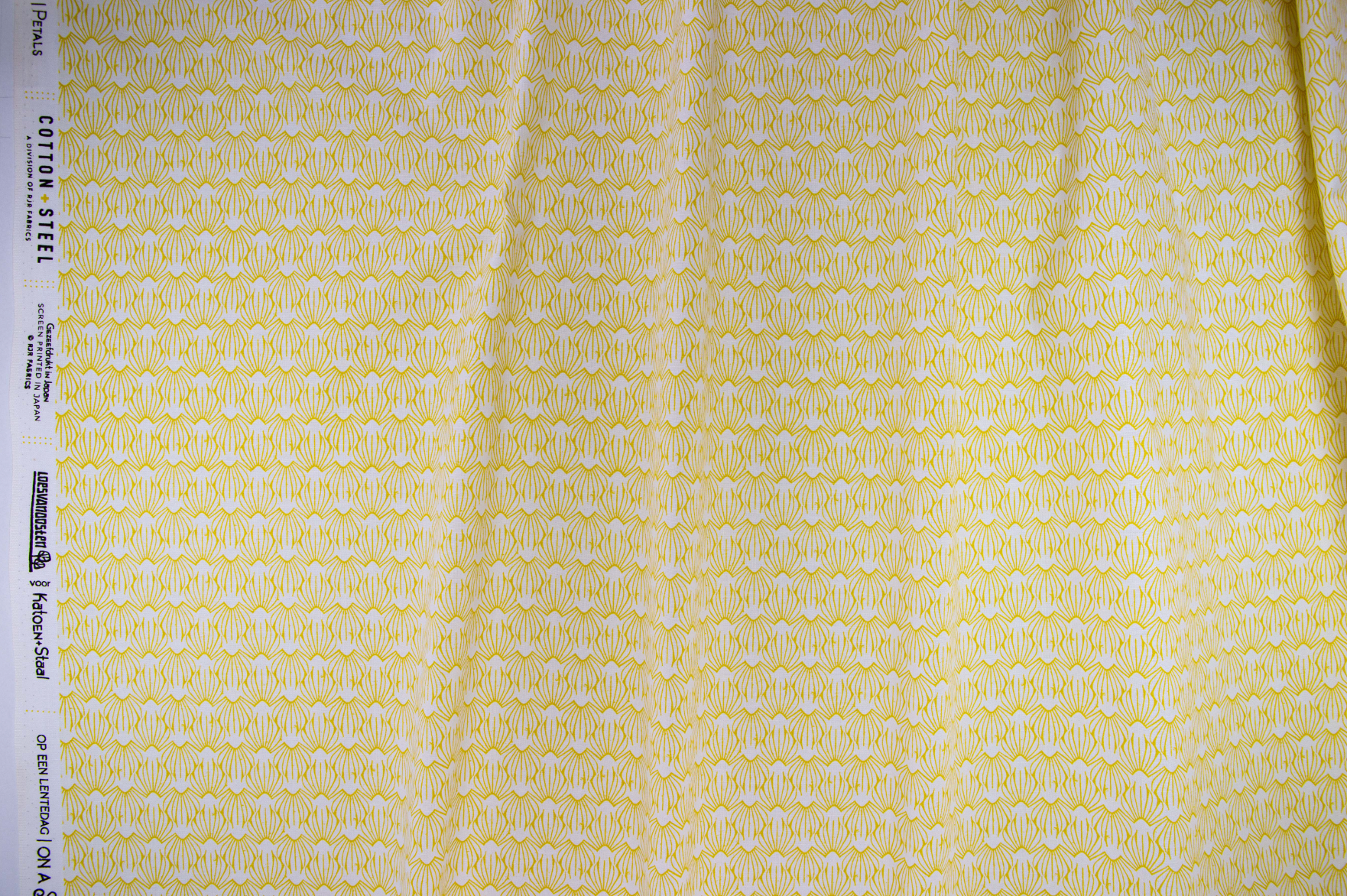 On a Spring Day – Petal – Sunshine fabric featuring delicate yellow petal motifs on a pale background by Loes van Oosten for Cotton+Steel.