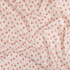 In The Woods – Acorn fabric by Loes Van Oosten featuring coral acorns on unbleached Japanese cotton by Kokka.