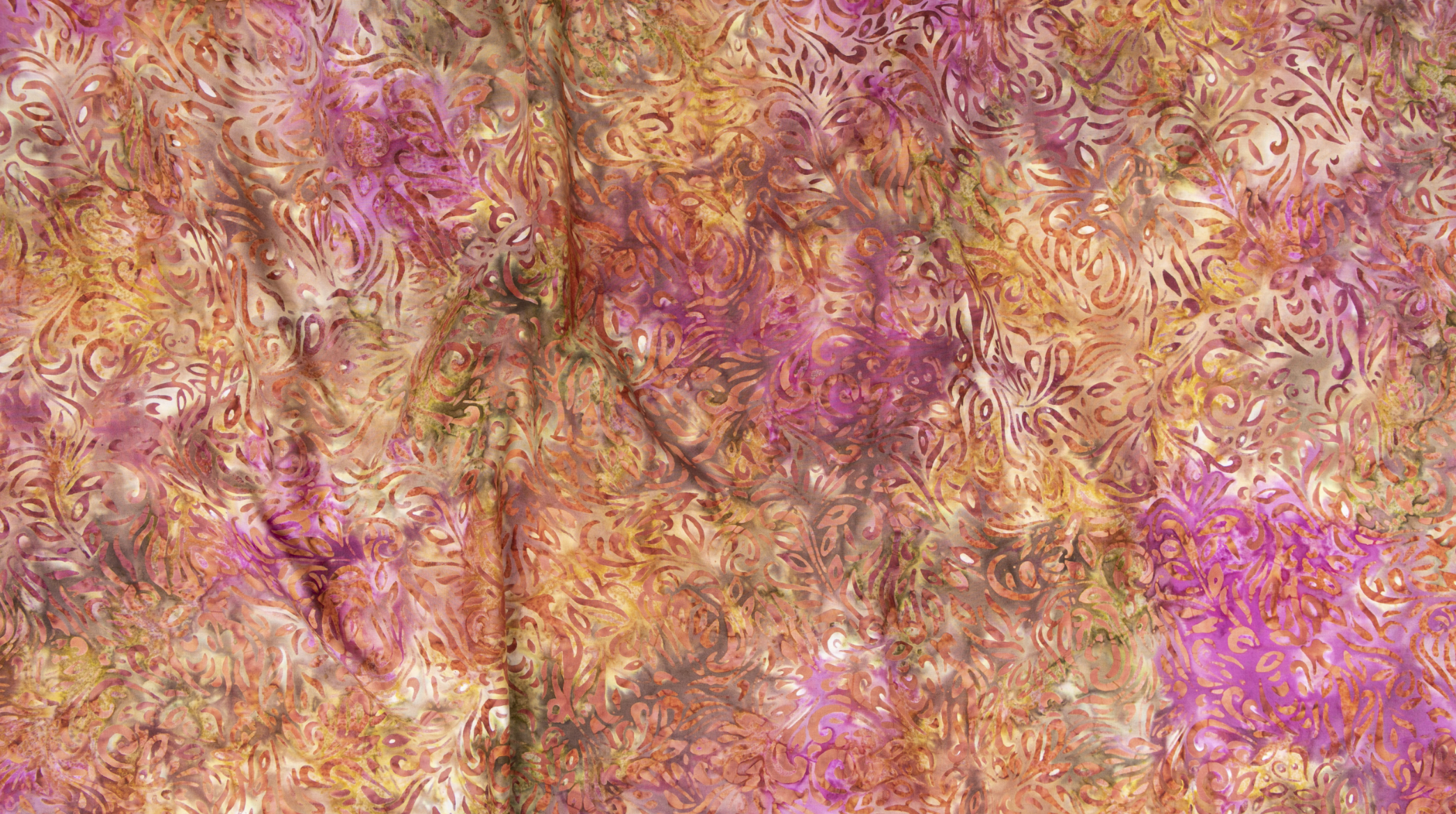 Malam Batiks VII Swirl in Fuchsia by Jinny Beyer – hand-dyed cotton fabric with bold pink and magenta swirls.