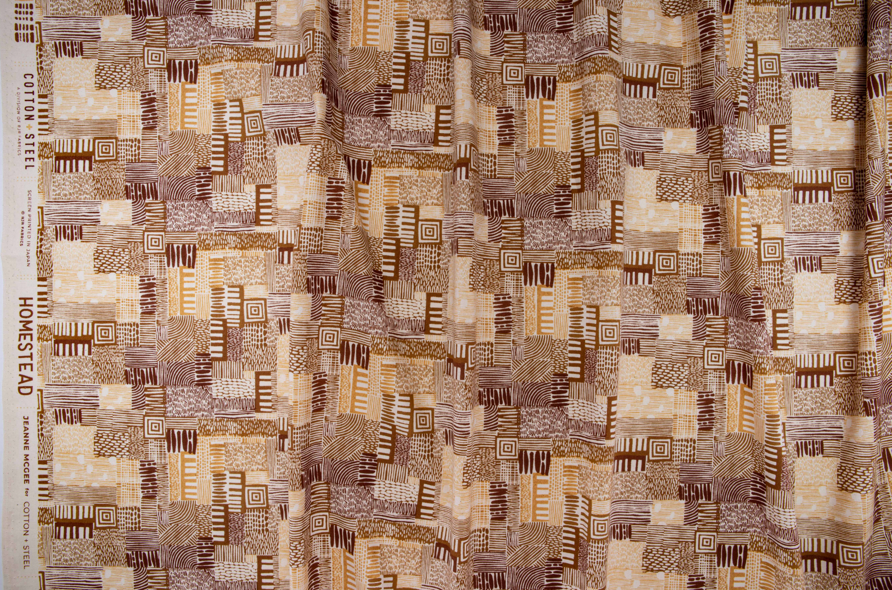Homestead – Plots – Gold Sand Unbleached Fabric by Jeanne McGee featuring geometric motifs on a natural background.