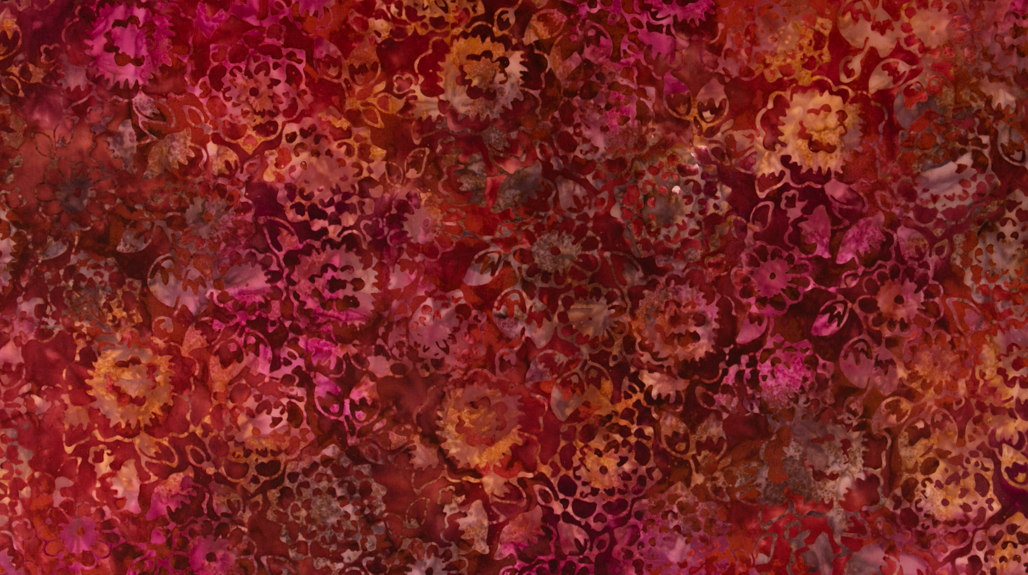 Malam Batiks VII Mums Burnt Orange Batik Fabric JB301-BU1B featuring intricate mum floral motifs in warm burnt orange hues.