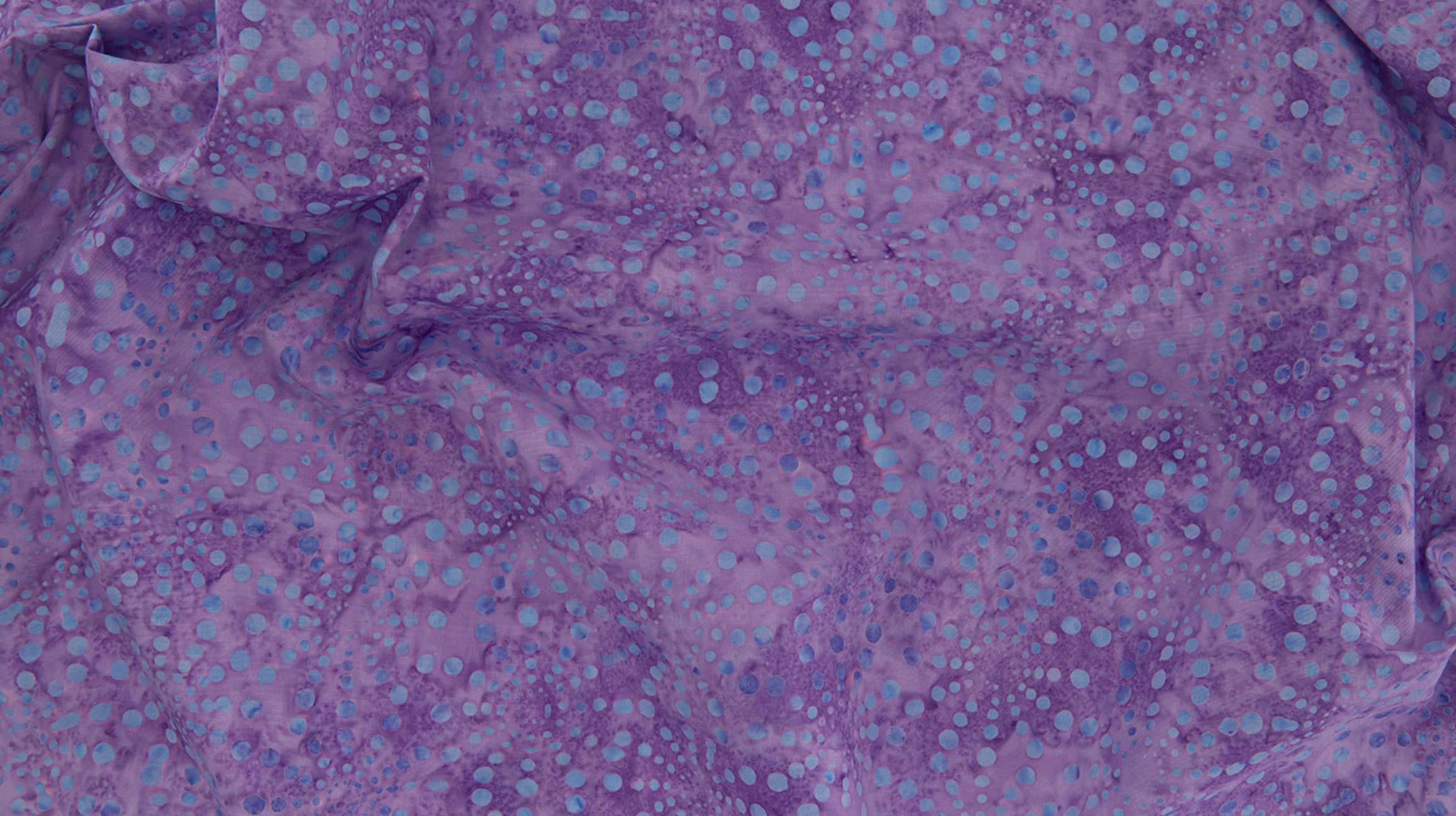 Bursts Lavender Batik Fabric by Jinny Beyer – hand-dyed batik quilting cotton in lavender from Malam Batiks VIII for RJR Fabrics.