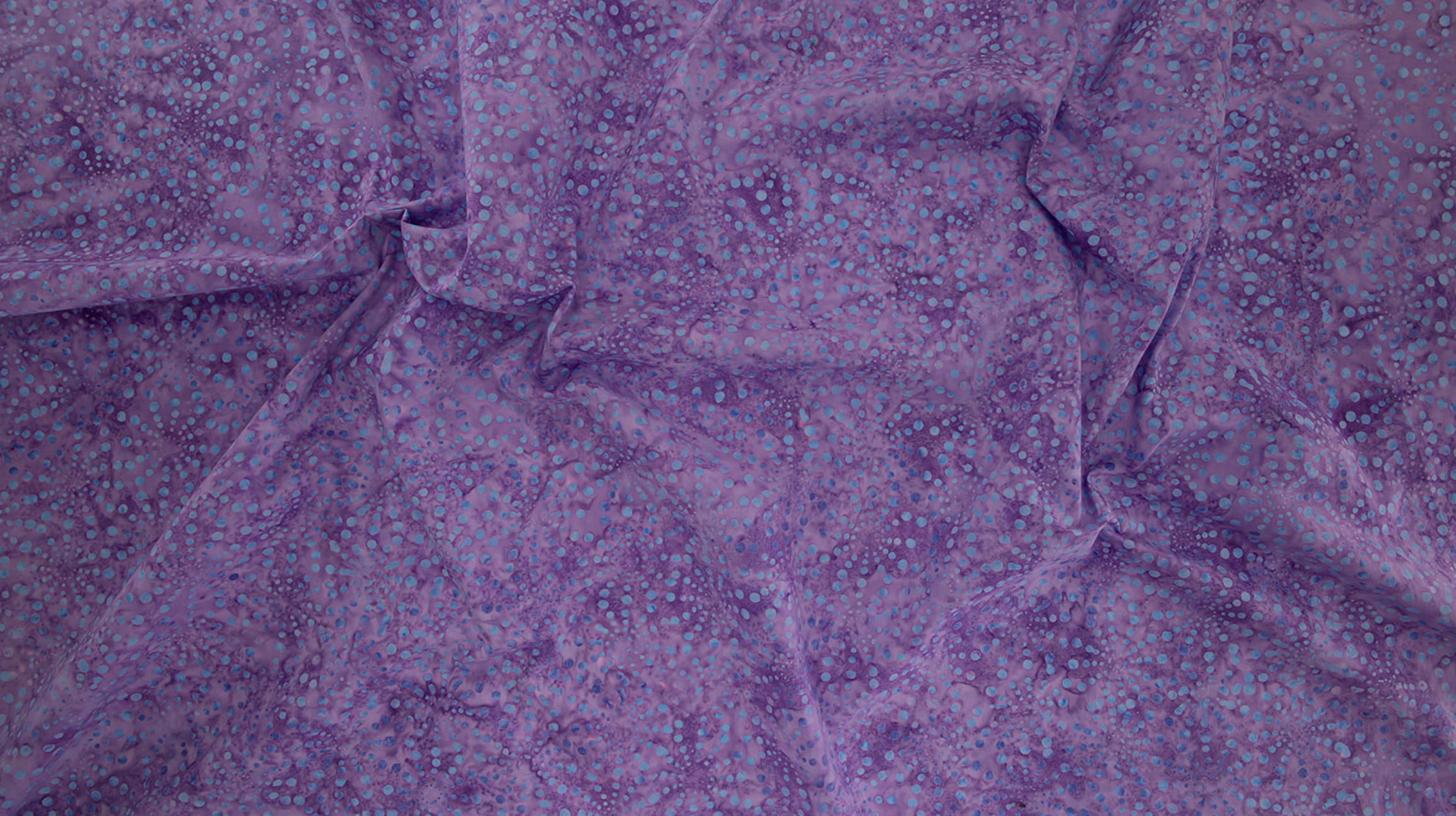 Bursts Lavender Batik Fabric by Jinny Beyer – hand-dyed batik quilting cotton in lavender from Malam Batiks VIII for RJR Fabrics.