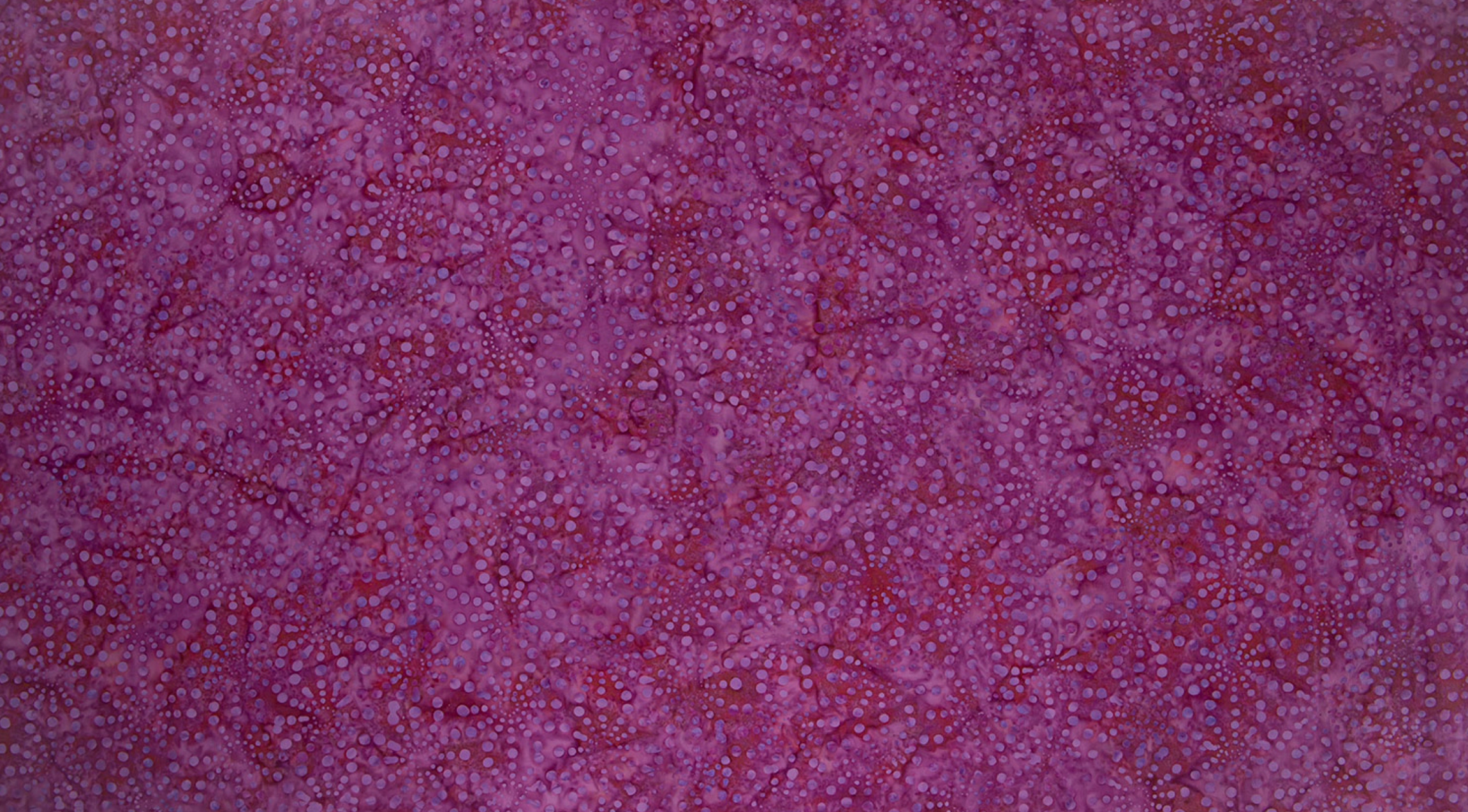 Bursts Pink Batik Fabric by Jinny Beyer – hand-dyed cotton batik in bright pink from Malam Batiks VIII for RJR Fabrics.