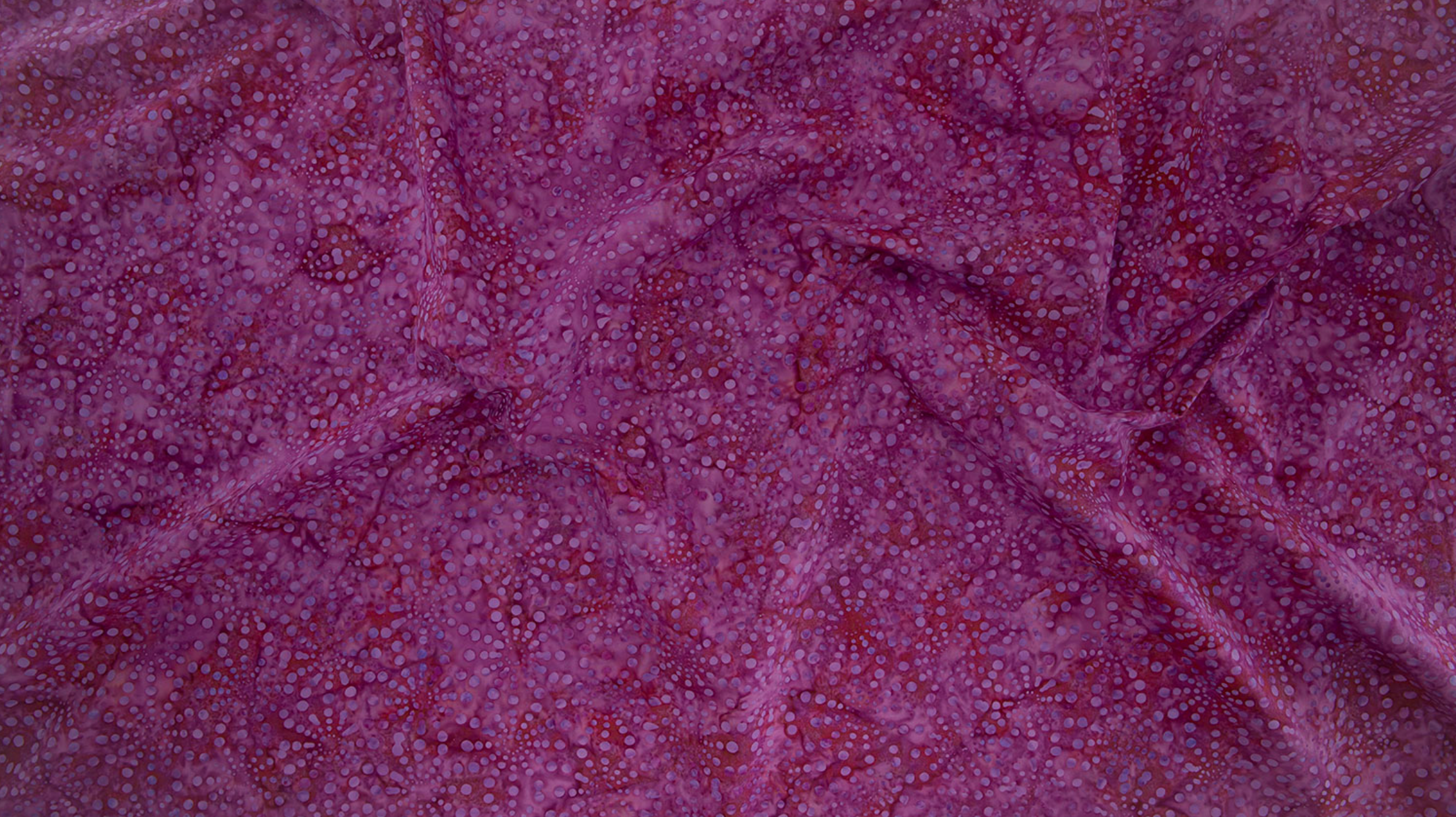 Bursts Pink Batik Fabric by Jinny Beyer – hand-dyed cotton batik in bright pink from Malam Batiks VIII for RJR Fabrics.