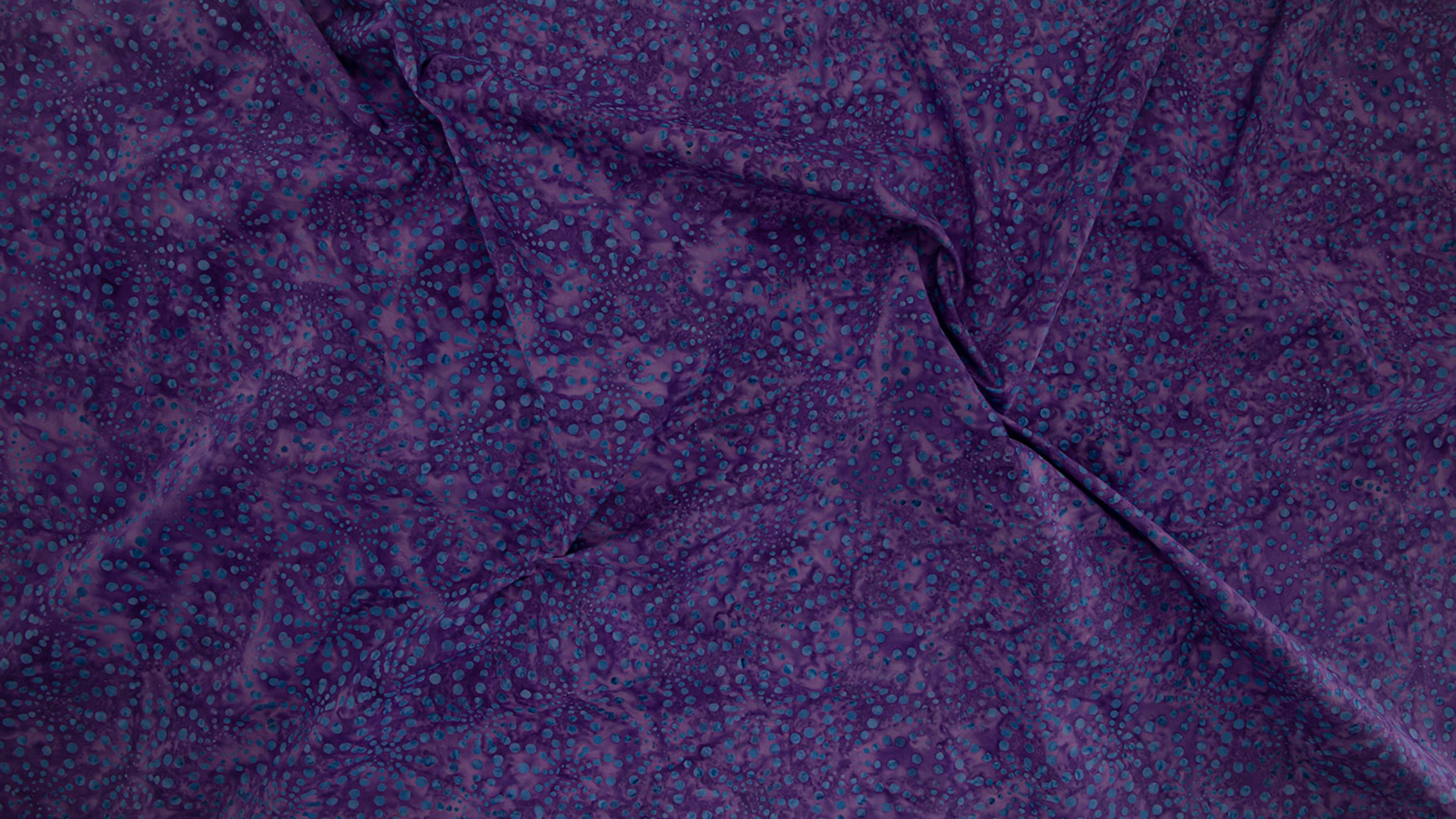 Bursts Purple Batik Fabric by Jinny Beyer – deep purple hand-dyed batik cotton from Malam Batiks VIII for RJR Fabrics.