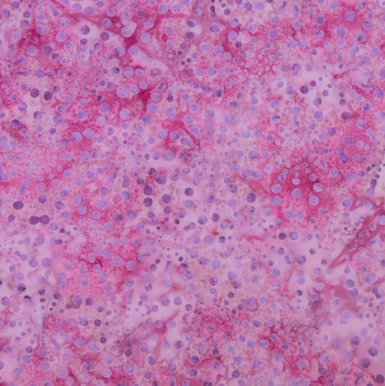Bursts Rose Batik Fabric by Jinny Beyer – hand-dyed pink cotton batik with subtle bursts from Malam Batiks VIII by RJR Fabrics.