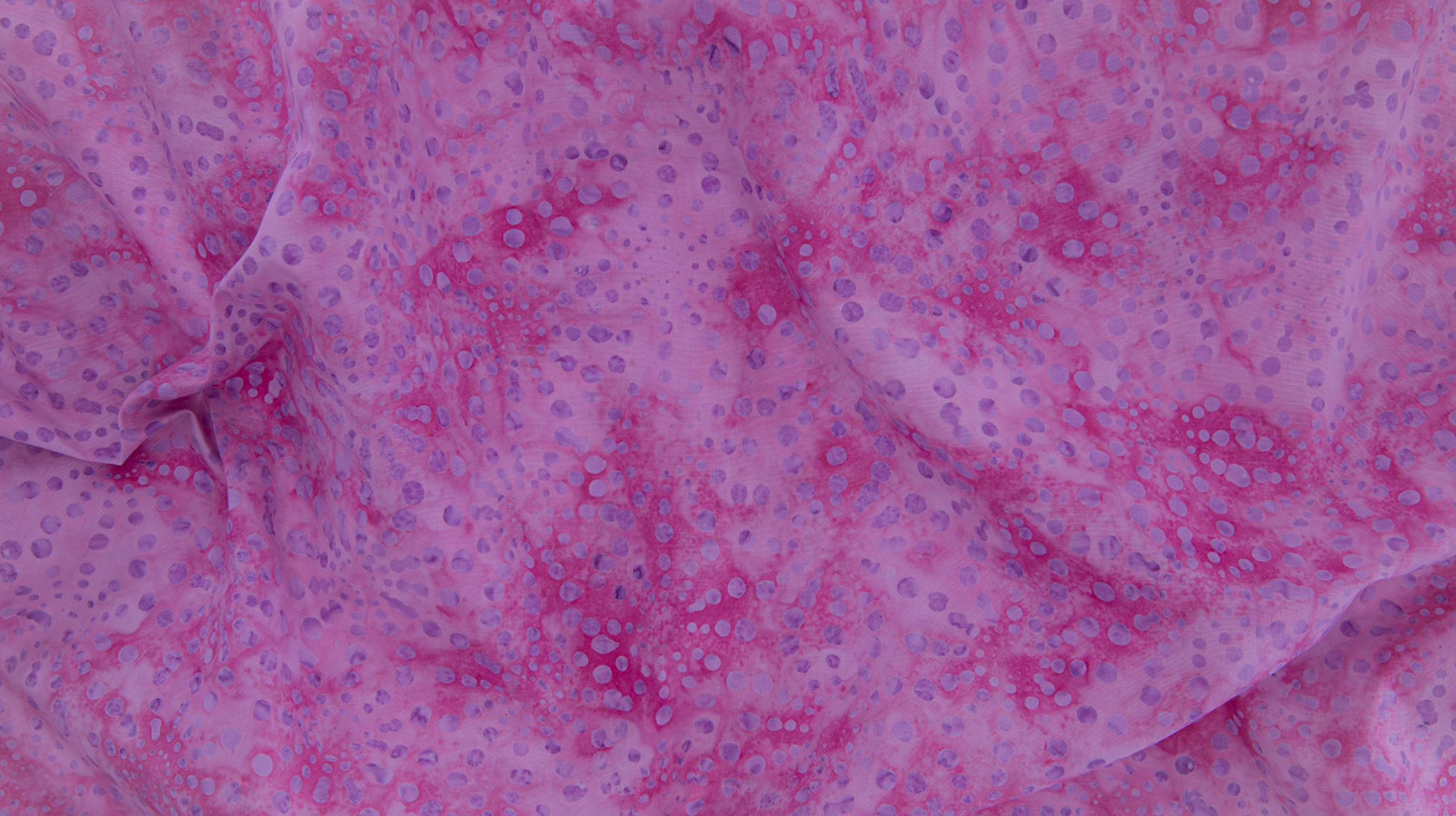 Bursts Rose Batik Fabric by Jinny Beyer – hand-dyed pink cotton batik with subtle bursts from Malam Batiks VIII by RJR Fabrics.