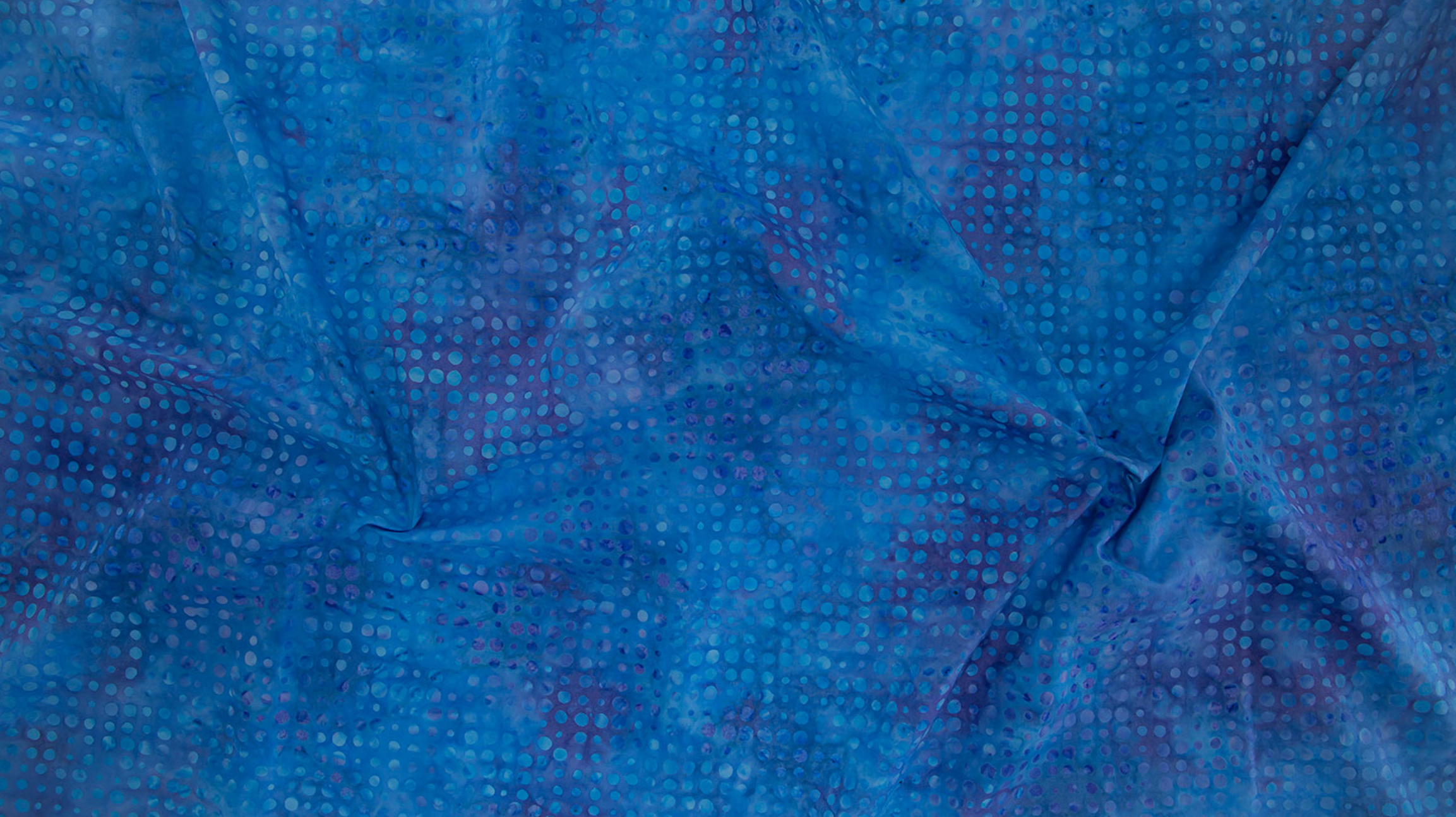 Dots Navy Batik Fabric by Jinny Beyer – dark blue hand-dyed cotton with scattered dot print from Malam Batiks VIII by RJR Fabrics.