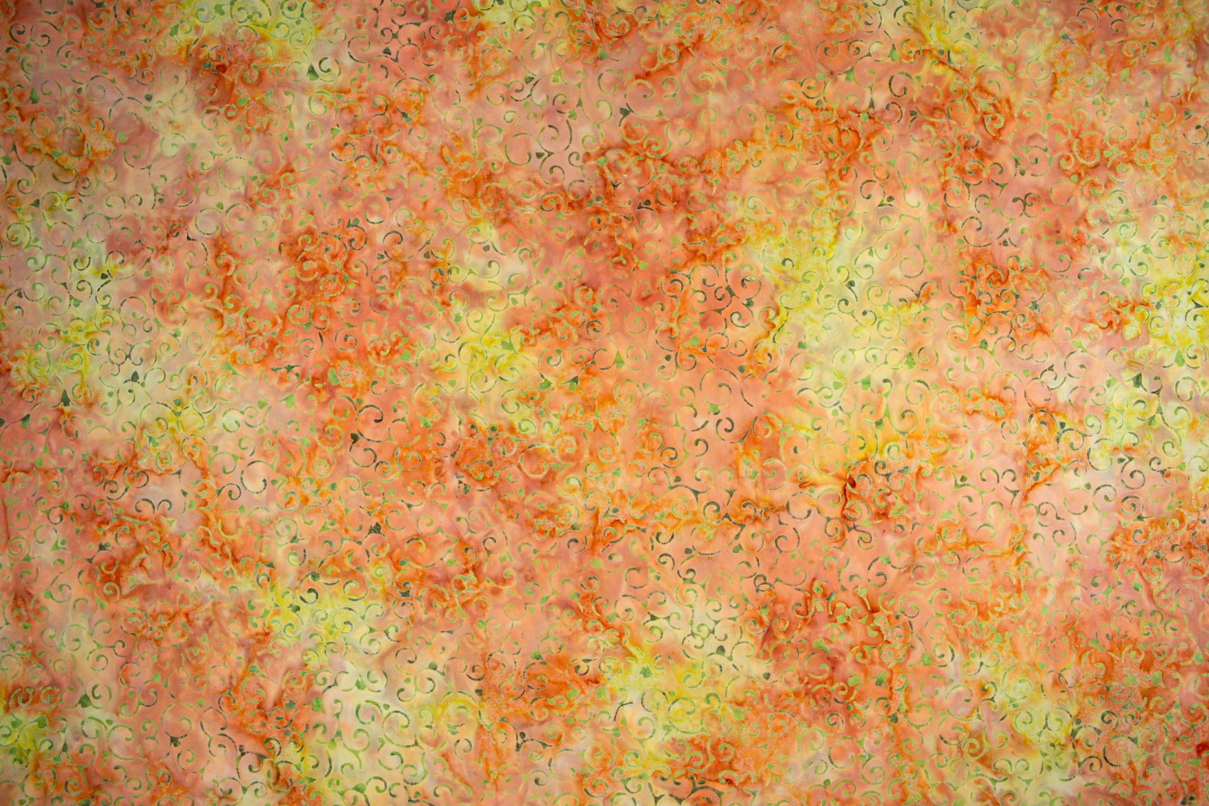 Scroll – Citrus batik fabric by Jinny Beyer - energetic scroll motif on bright citrus cotton.